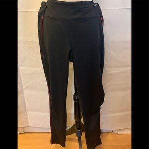 Danskin black leggings with pink pin stripe down side. Size L NWOT